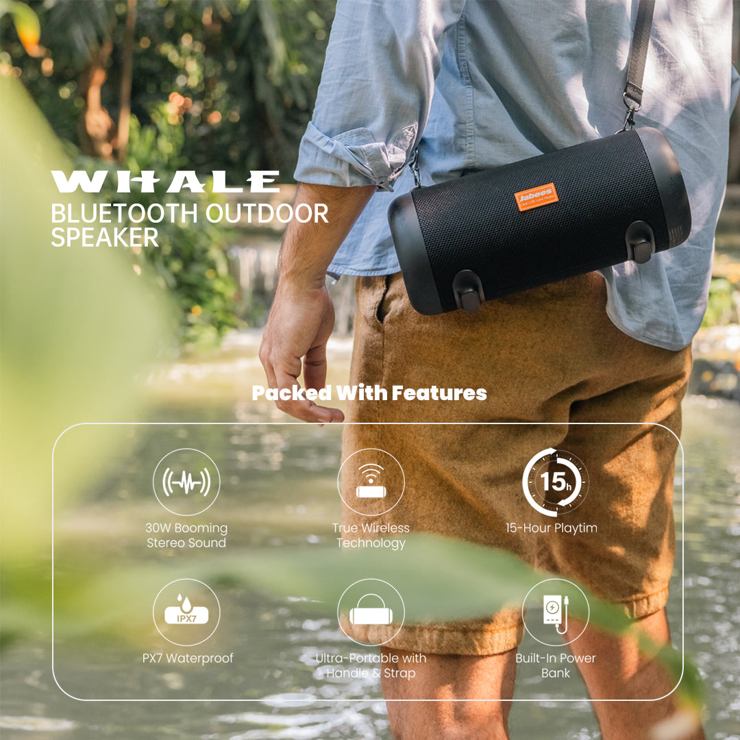 Person holding a Whale Bluetooth outdoor speaker with features displayed on screen