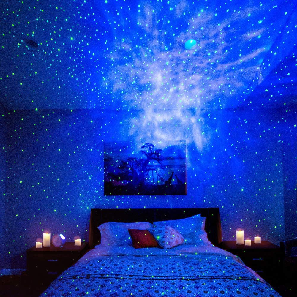 Bedroom with starry night light projector on ceiling