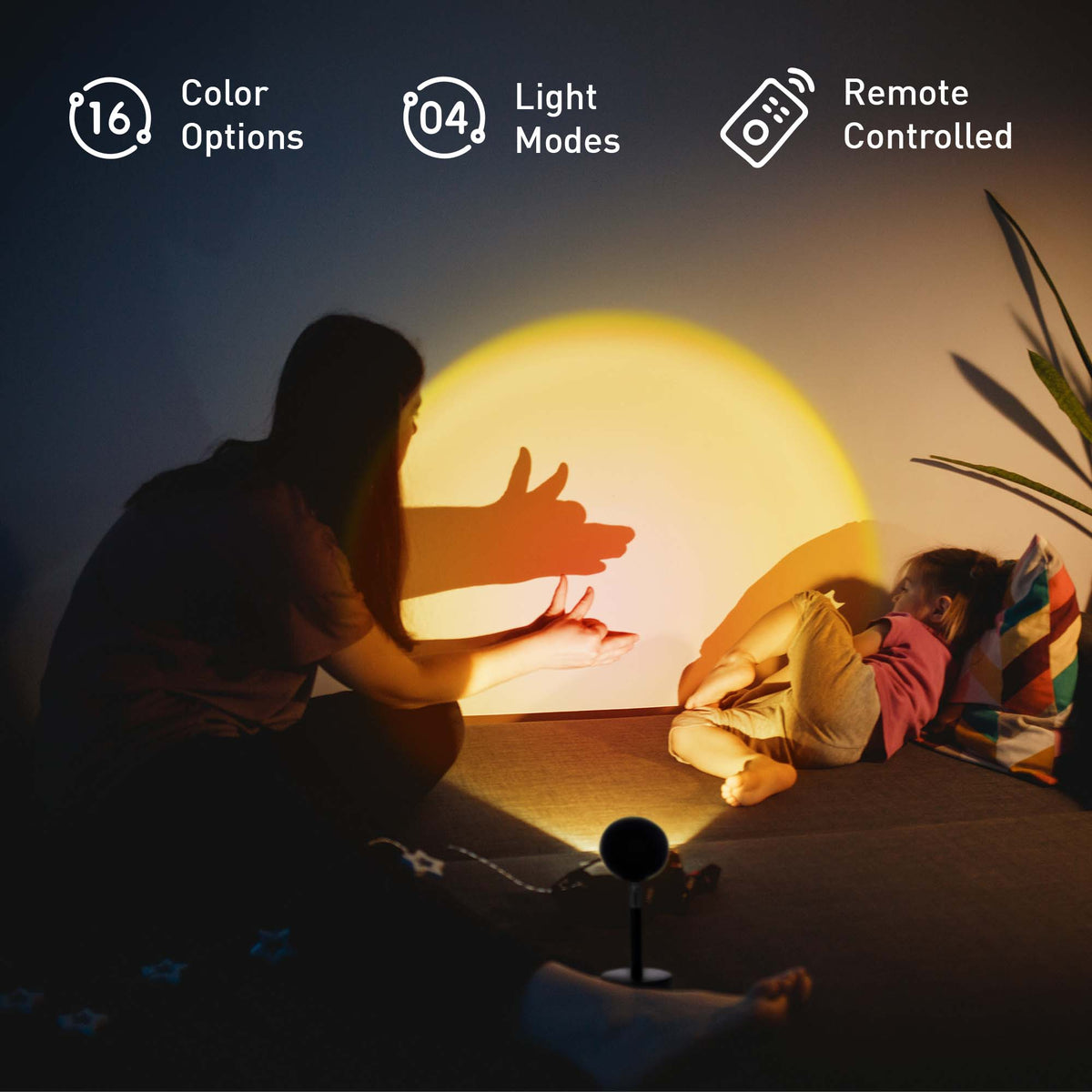 Two children playing with a glowing orb in a dark room, with text indicating color options, light modes, and remote control.