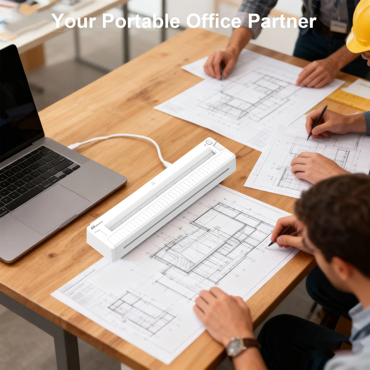 People working on blueprints with a portable office setup including a laptop and document holder.