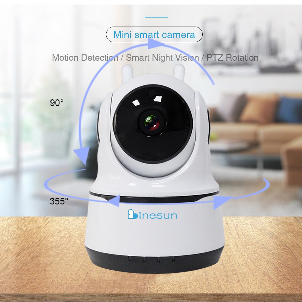 Mini smart camera with motion detection and PTZ rotation features on a wooden surface.