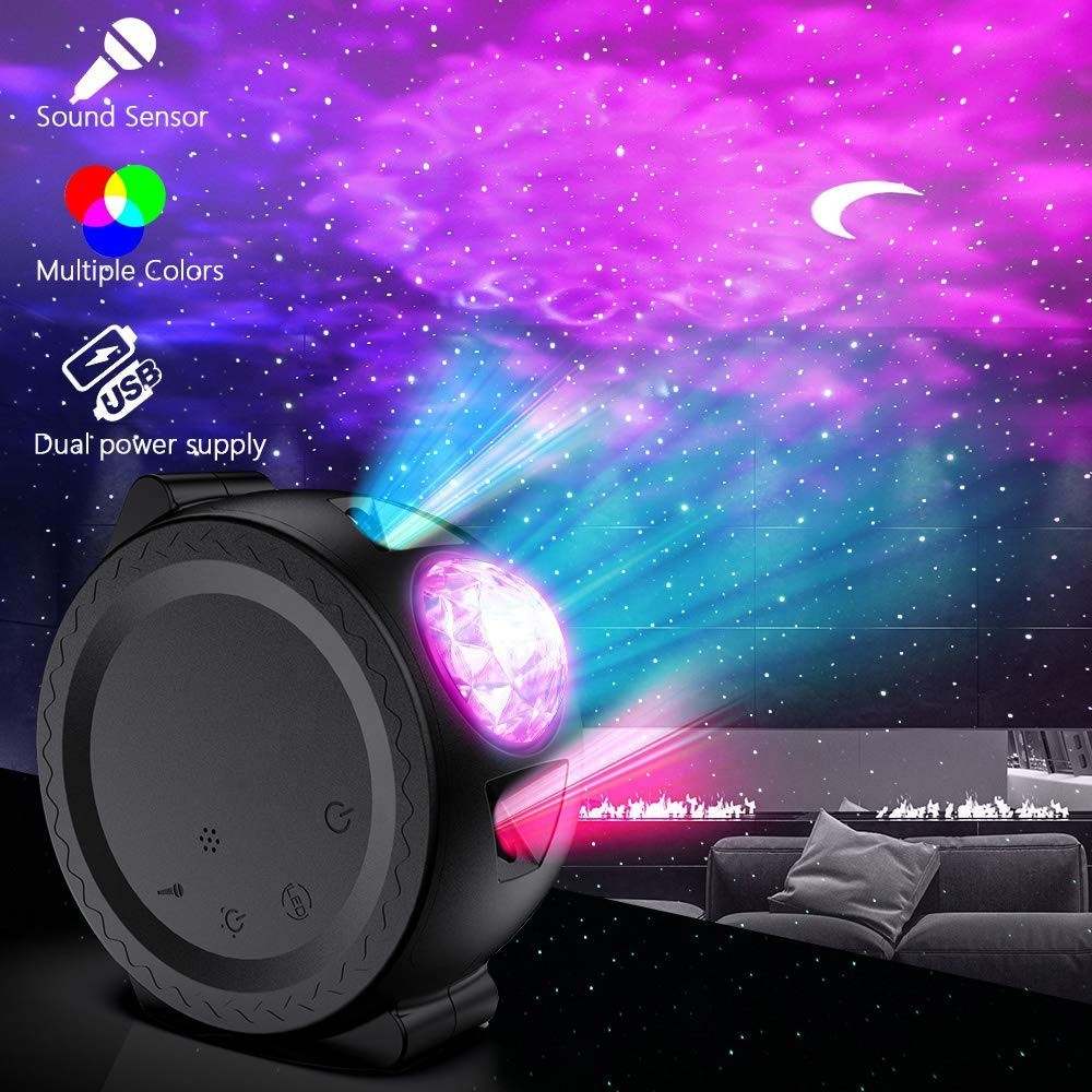 Star projector with colorful light display in a room setting