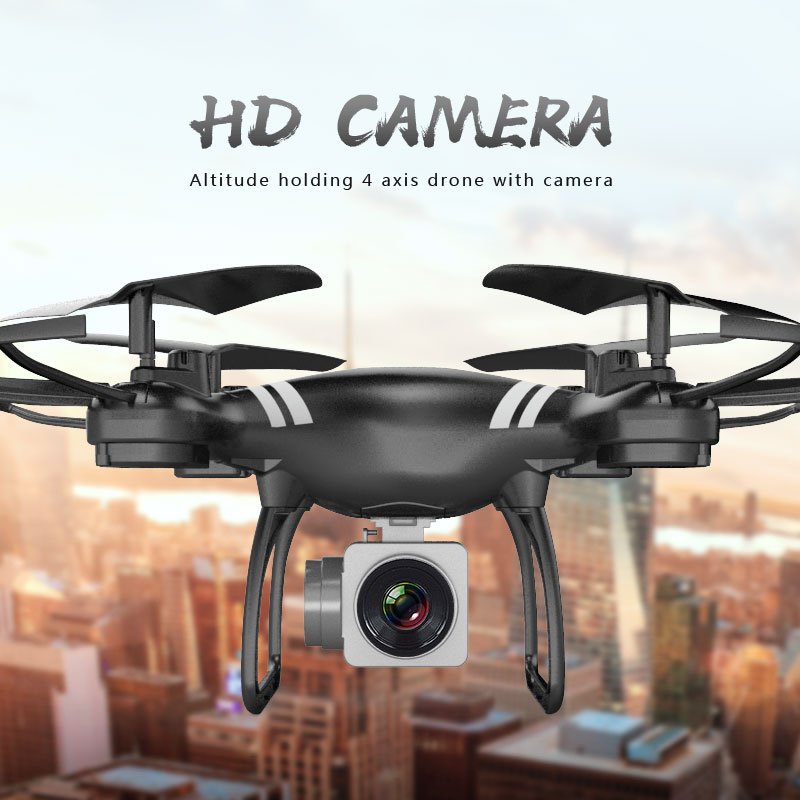 Black 4-axis drone with camera on a blurred cityscape background